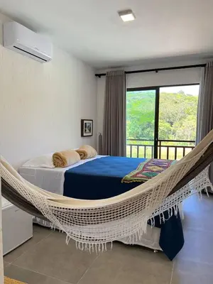 Uma cama ou camas num quarto em Pousada do Lago