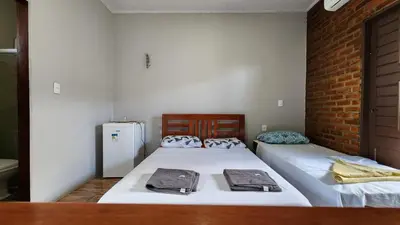 Uma cama ou camas num quarto em Suítes Green Village Flecheiras