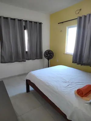Uma cama ou camas num quarto em Casa Tropicana (2º andar)
