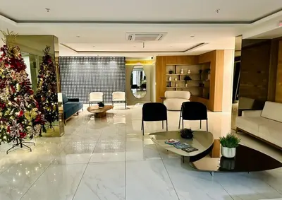 Uma área de estar em Apartamento Aquarius Residence