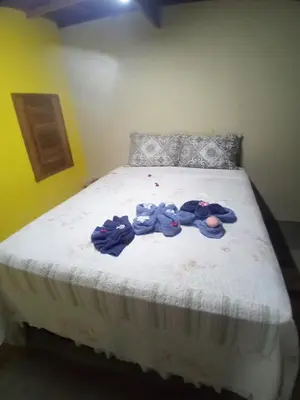 Uma cama ou camas num quarto em Chales Da Mata