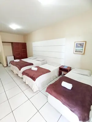 Uma cama ou camas num quarto em Ocean Praia Hotel
