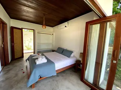 Uma cama ou camas num quarto em Casa Cajueiro - Os Navegantes