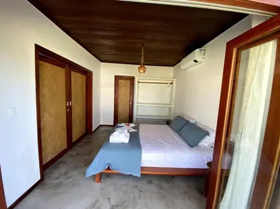 Uma cama ou camas num quarto em Casa Cajueiro - Os Navegantes