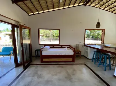 Uma cama ou camas num quarto em Casa Cajueiro - Os Navegantes