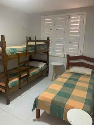 Uma cama ou camas num quarto em Apartamento térreo no Morro Branco Marina II