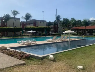 A piscina em ou perto de Apartamento térreo no Morro Branco Marina II