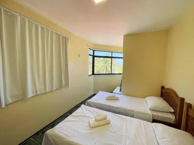 Uma cama ou camas num quarto em Apartamento na praia da tabuba com vista mar
