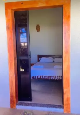 Uma cama ou camas num quarto em Pousada das Canoas