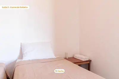 Uma cama ou camas num quarto em Apto c/ churrasqueira no Pontal do Maceió Tactu