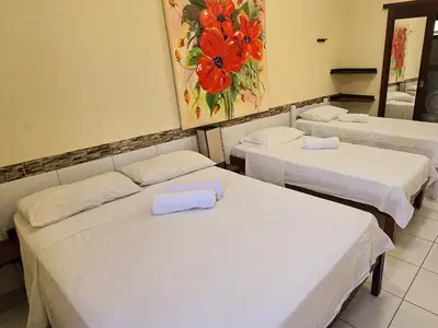 Uma cama ou camas num quarto em Pousada Viva Praia