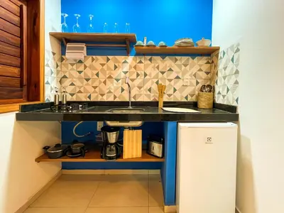 A cozinha ou kitchenette de Chalés Mahalo J - Pontal de Maceió - Fortim