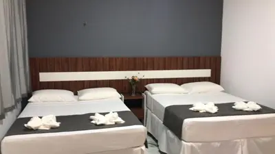 Uma cama ou camas num quarto em WL IMPERIO HOTEL POUSADA