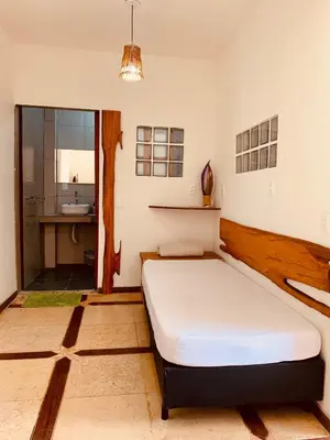 Uma cama ou camas num quarto em Pousada Casa do Bruno