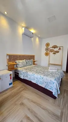 Uma cama ou camas num quarto em Pousada Solarium
