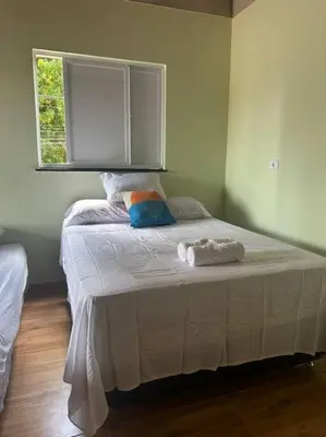 Uma cama ou camas num quarto em Apartamento 200m da lagoa