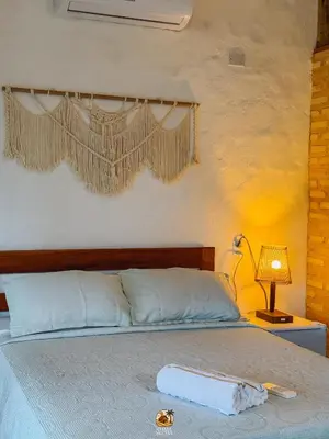Uma cama ou camas num quarto em Moitas chalés