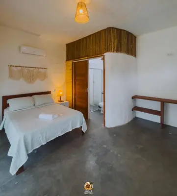 Uma cama ou camas num quarto em Moitas chalés