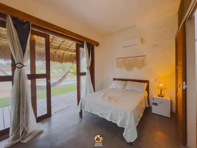 Uma cama ou camas num quarto em Moitas chalés
