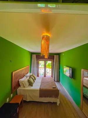 Uma cama ou camas num quarto em Villa Jaguar Fortim