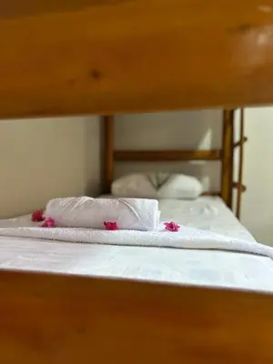 Uma cama ou camas num quarto em Pousada Imperio dos Bambus