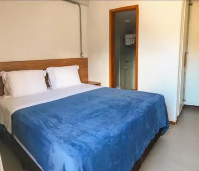 Uma cama ou camas num quarto em Apartamento com garagem no Centro de Guaramiranga