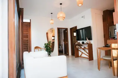 Uma televisão e/ou sistema de entretenimento em Saona Bangalôs Taíba