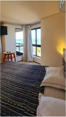 Uma cama ou camas num quarto em Flat no Iate Plaza Hotel