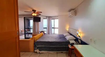 Uma cama ou camas num quarto em Flat no Iate Plaza Hotel