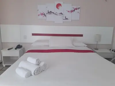 Uma cama ou camas num quarto em Flat Golden Fortaleza