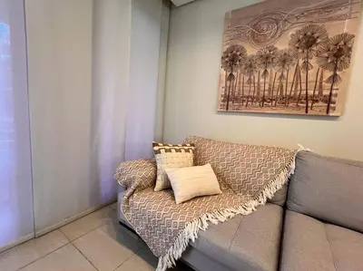 Uma área de estar em Beach Place Resort - Térreo