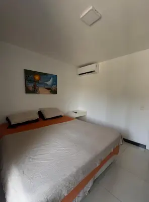 Uma cama ou camas num quarto em Eco Paradise Apto 214