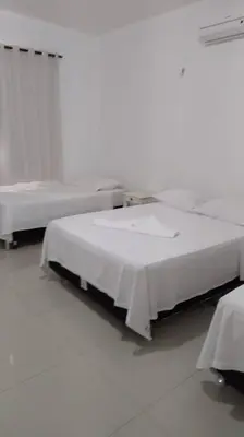 Uma cama ou camas num quarto em Chalé La Fazenda