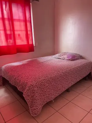 Uma cama ou camas num quarto em Apartamento Familia LL