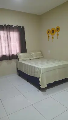 Uma cama ou camas num quarto em Espaço Analu