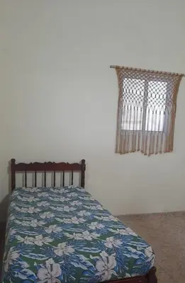Uma cama ou camas num quarto em Espaço Analu