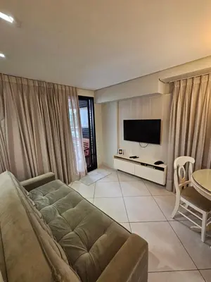 Uma televisão e/ou sistema de entretenimento em Apartamento Landscape Beira Mar - Meireles