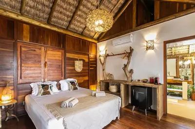Uma cama ou camas num quarto em Rancho Noé Cumbuco