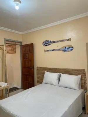 Uma cama ou camas num quarto em Pousada perto do mar