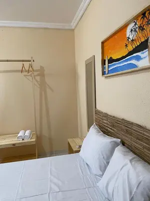 Uma cama ou camas num quarto em Pousada perto do mar