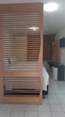 Uma cama ou camas num quarto em Hotel Praia 2000