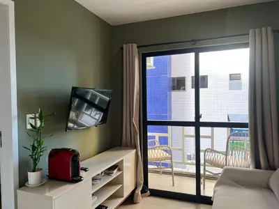 Uma televisão e/ou sistema de entretenimento em Apartamento Meireles - Beira mar