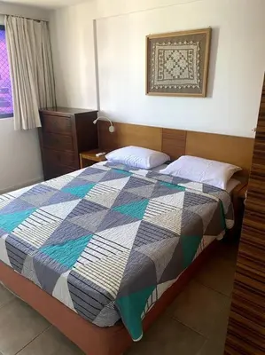 Uma cama ou camas num quarto em Flat no Coração do Meireles - Apto 1906