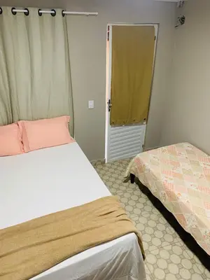 Uma cama ou camas num quarto em Recanto tia tonha