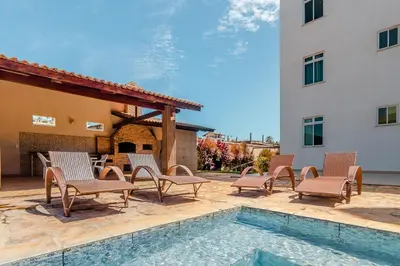 A piscina em ou perto de 2 suítes temporada - VENTILADO E NASCENTE, condomínio tranquilo com PISCINA, CHURRASQUEIRA E PLAYGROUND I Cozinha completa, estacionamento coberto, home office I Ideal para FAMÍLIAS E CASAIS I Prox do BEACH PARQUE e PRAIA - Porto das Dunas - CE