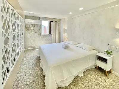 Uma cama ou camas num quarto em Aconchego à Beira Mar (no melhor do Meireles)