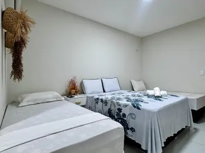 Uma cama ou camas num quarto em Pousada du Vento