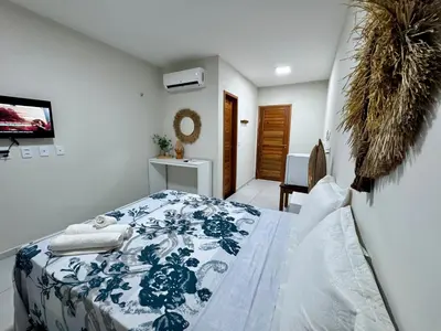 Uma cama ou camas num quarto em Pousada du Vento