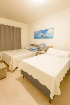 Uma cama ou camas num quarto em Apartamento completo Excelente localização Centro