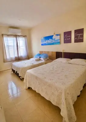 Uma cama ou camas num quarto em Apartamento completo Excelente localização Centro